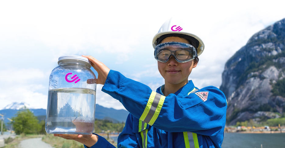 Person holding jar of CO2 derived fuel